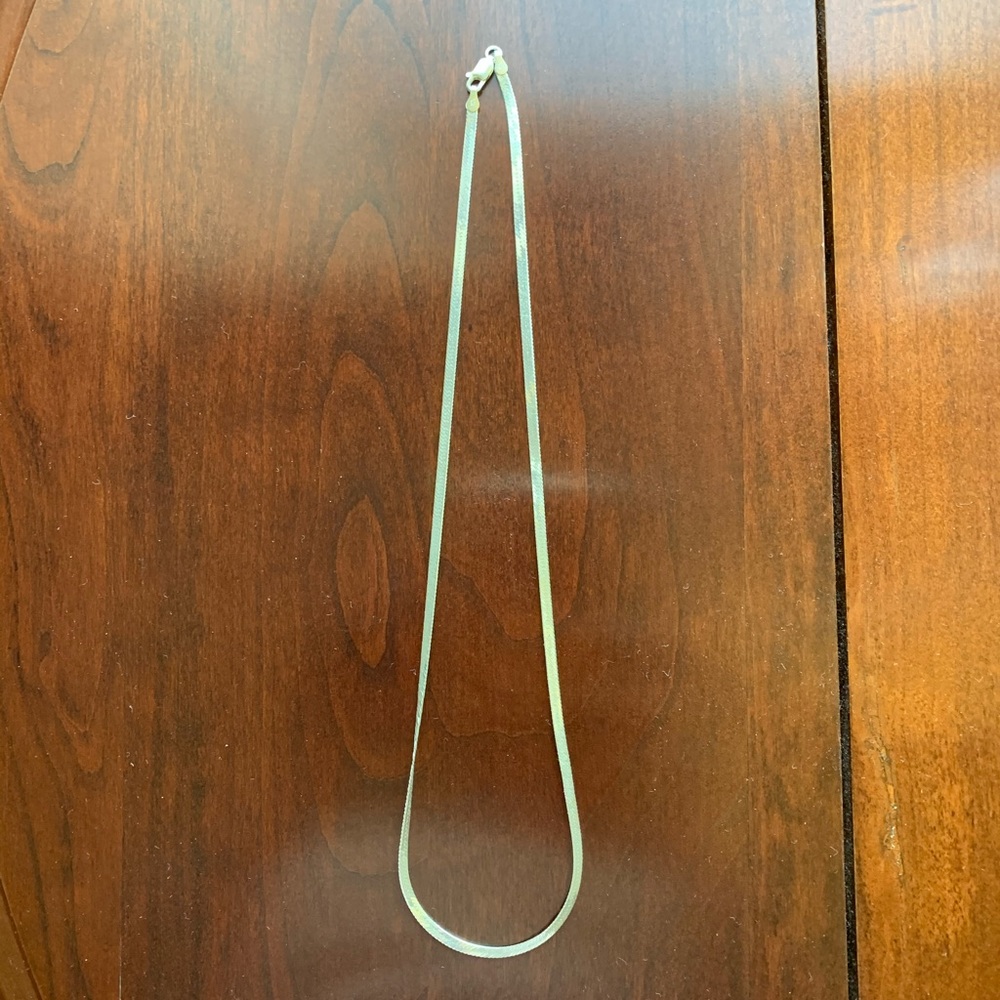 Sterling silver herringbone necklace.